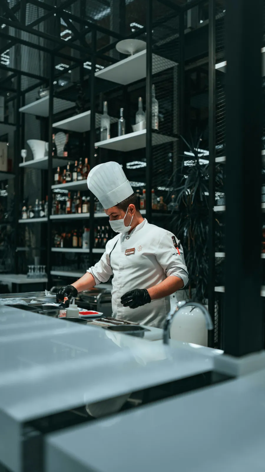 A chef in a hat cooking in a kitchen